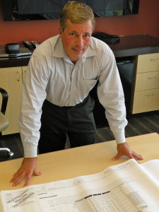 n a 2010 photo, Richard Bach, head of Turner Construction’s San Diego operations, is shown with schematics of the Downtown Library.