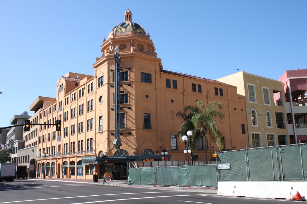 Gates concealing the construction on the public park at Horton Plaza are seen next to the Balboa Theatre on Broadway Avenue in downtown San Diego, March 2014.