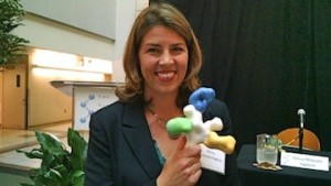 Dr. Erica Ollmann Saphire of the Scripps Research Institute holds a model of the Ebola virus. (Photo by Chris Jennewein)