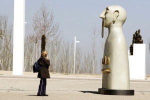 A passerby observes one of the ten bronze sculptures in Rivelino's exhibit, "Our Silences," when it was displayed in Madrid. Photo courtesy of Rivelino.