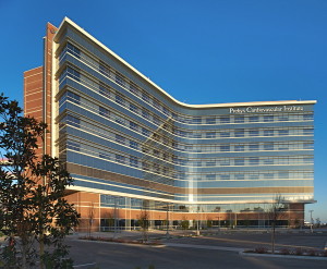The Prebys Cardiovascular Institute building exterior. Featuring floor-to-ceiling glass to give patient rooms abundant natural, healing light and a curved design that keeps caregivers nearby, the design of PCI is centered around patient needs.