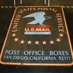 Carved wood USPS sign