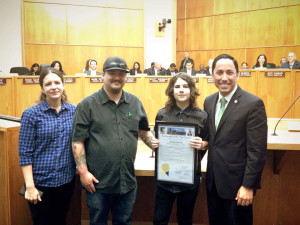 Nathan Odom holds proclamation, joined by his parents and Councilman Todd Gloria.