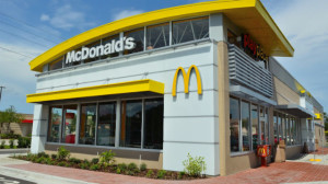 McDonald’s officials said about 10 percent of the restaurants in the country are company-owned, and the new benefits will affect about 90,000 employees.