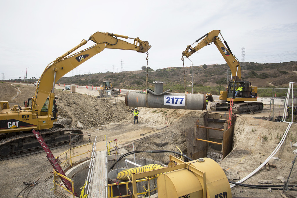  Installing the final segment of the 10-mile pipeline.