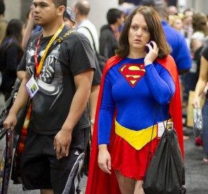 A Comic-Con attendee using a cell phone.