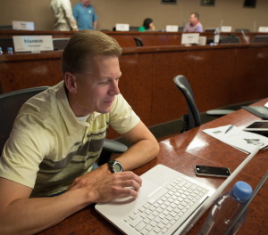 A student in the Executive MBA program studies at a computer.