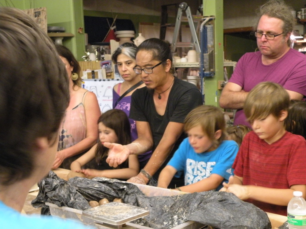 Kouta Shimazaki gives hands-on instructions to volunteers at a recent ‘Throwathon.’