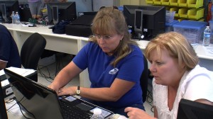 Lisa Barnett, a Rancho Bernardo teacher, debugs a computer program with her classmate at a San Diego State training program on July 16, 2012. (Photo by Katie Schoolov)