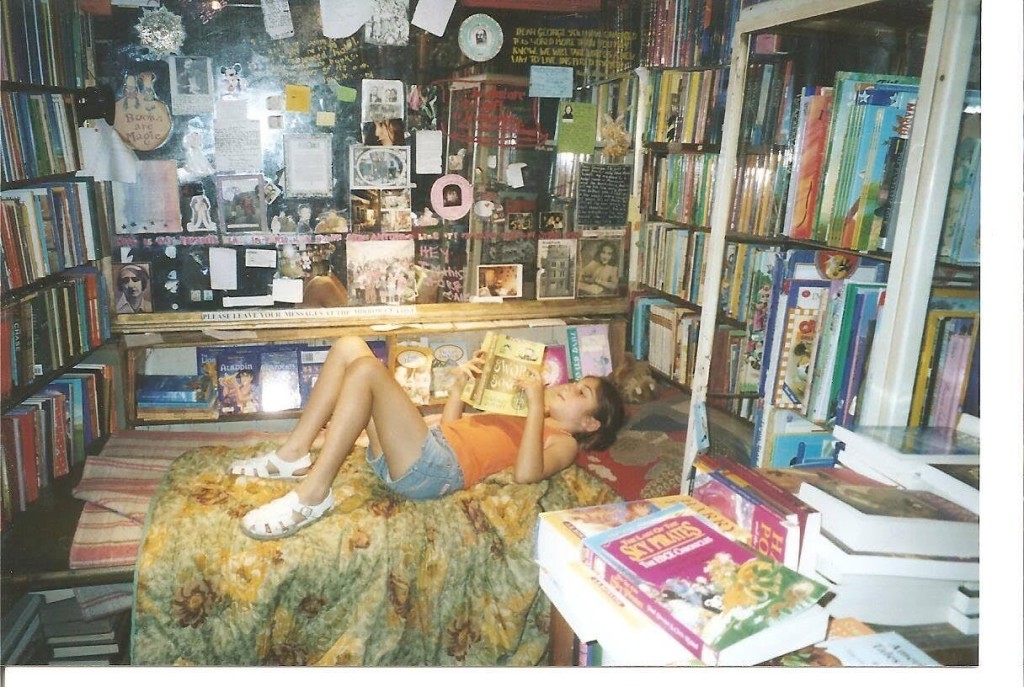Katie, at age 8, reads a books from a Shakespearean bookstore in Paris.