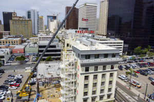 Crane hoists Hotel Churchill sign