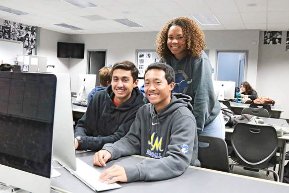 Students at Mira Mesa High School participate in a college-level class, earning credits for high school and college at the same time.