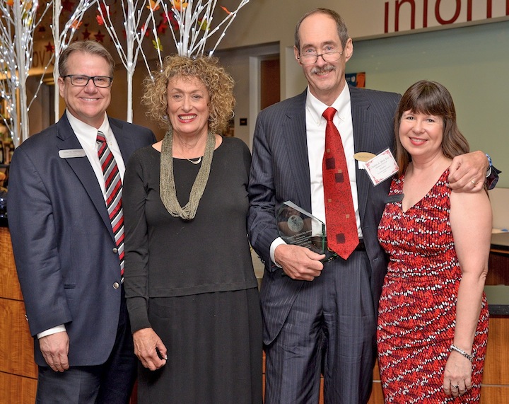 Pictured from left: Director of Libraries John Adkins, presenter alumna Susanne Stanford, awardee Charlie Bird, and Events Committee Chair Kay Catherwood. (Photo: Robin Wood/Gates Photography) 