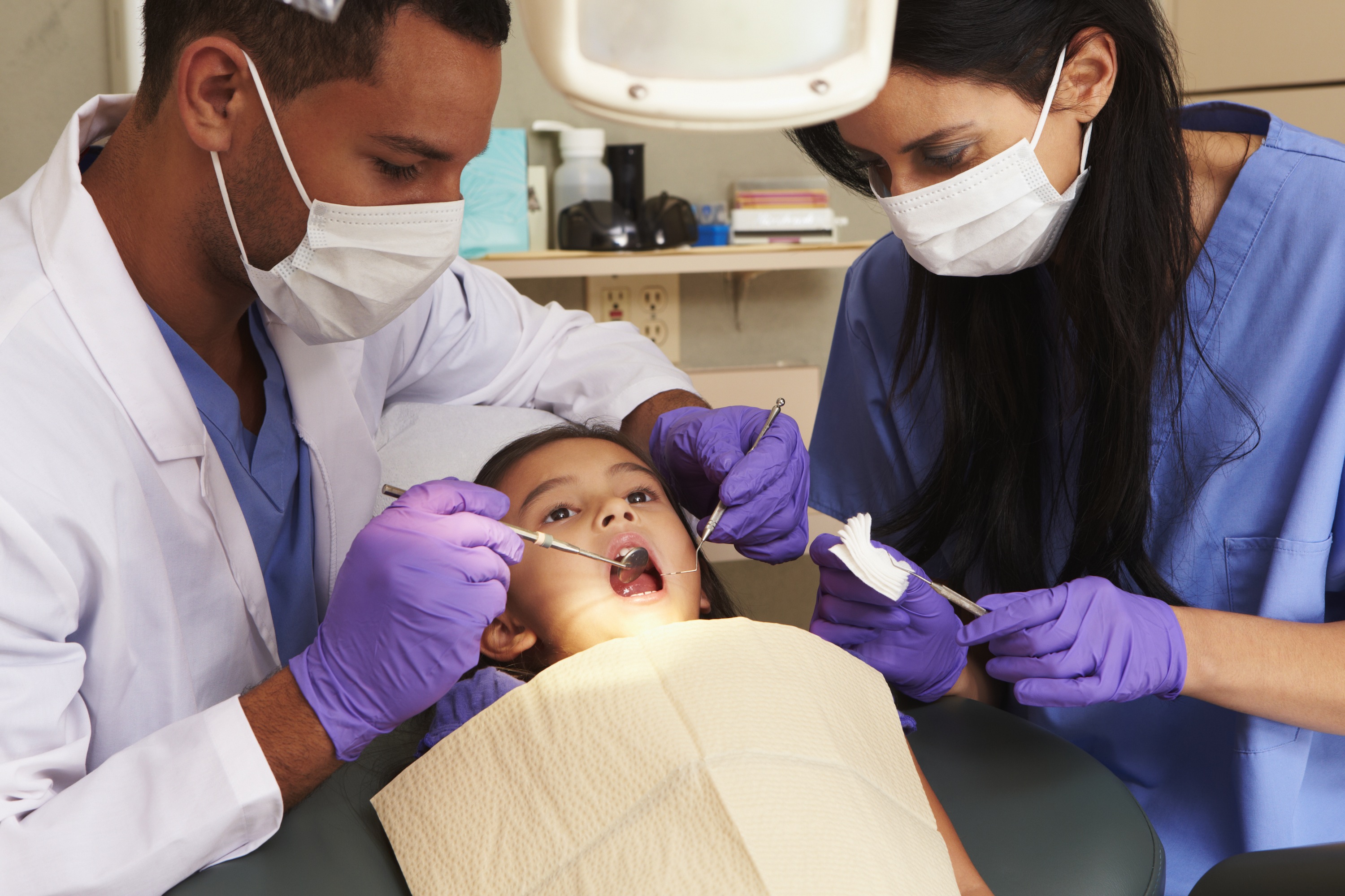 Young girl having check up at Dentists Surgery