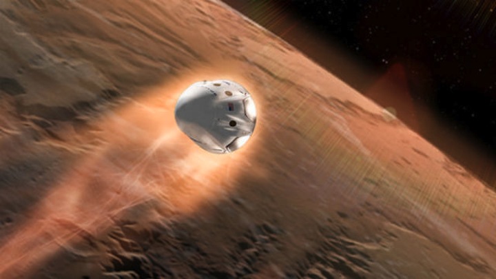 A SpaceX capsule descends toward a landing on Mars. (Image from SpaceX presentation)