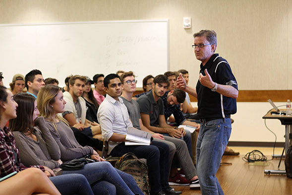 Lavin Entrepreneurship Center Director Bernhard Schroeder speaks with students about entrepreneurship. (Credit: Lavin Entrepreneurship Center)