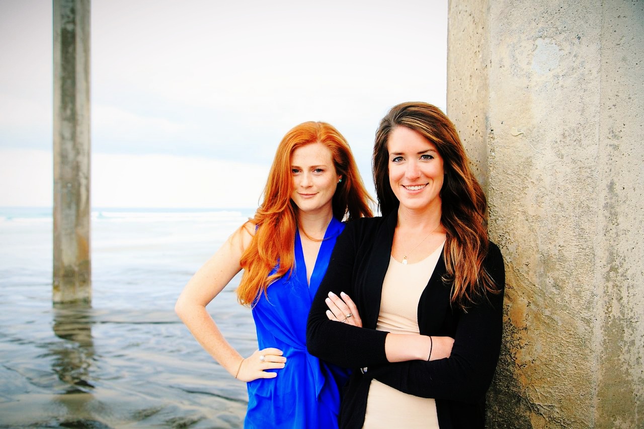 Scripps alumnae Amber Jackson and Emily Callahan beneath Scripps Pier. (Photo: Theresa Stafford / Black Hand Gallery)