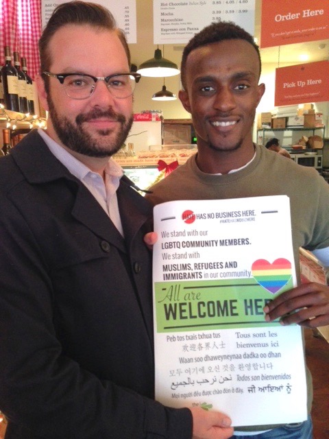 Holding the welcome sign are Mikey Knab, business operations manager at Ponce’s Mexican Restaurant on Adams Avenue (left) and Gloire Bora, manager of Pappelecco Italian restaurant on Adams Avenue.