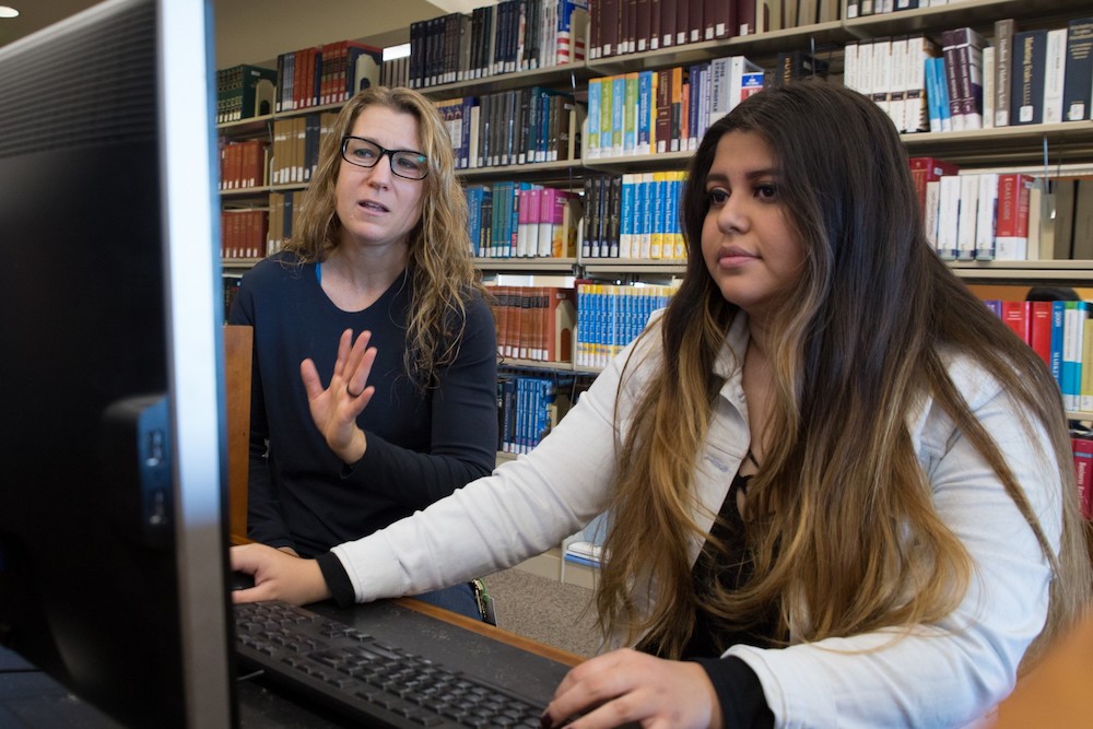 Yvonne Nalani Meulemans, head of teaching and learning at the Cal State San Marcos Library, with a university student Victoria Garcia. (Courtesy Cal State San Marcos)