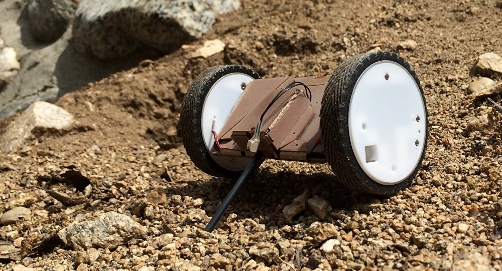 The Pop-Up Flat Folding Explorer Robot has been tested in various terrains such as the Mojave Desert in California.