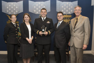 The SPAWAR 3D scanning team are recognized during the 2016 Secretary of the Navy Innovation Awards ceremony. From left, Lt. Jessica Fuller, Heidi Buck, Lt. Clay Greunke, Dr. Mark Bilinski and Stephen Cox. (U.S. Navy photo by Mass Communication Specialist 2nd Class Jonathan B. Trejo)
