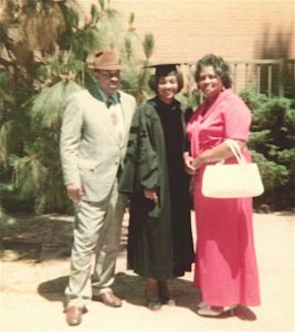 Weber received her PhD from UCLA in 1975. She appears here with her parents, David and Mildred.