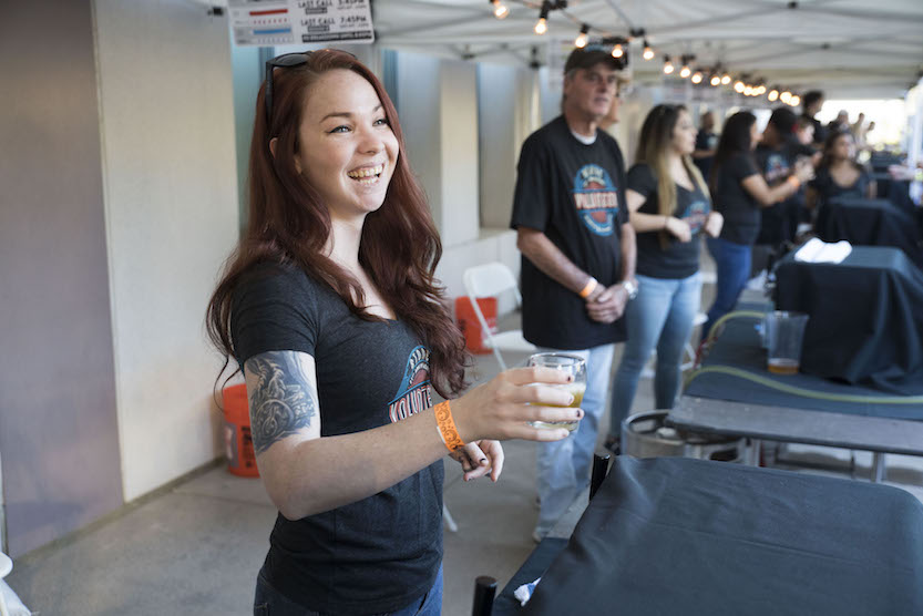 Volunteer offers beer samples at the launch of Brewchive. (Courtesy of CSUSM)