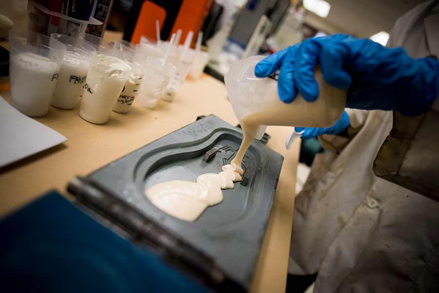 UC San Diego students pour polyurethane into the flip flop mold. “In the laboratory, students are far more engaged when they’re actually trying to solve a problem,” says Skip Pomeroy.