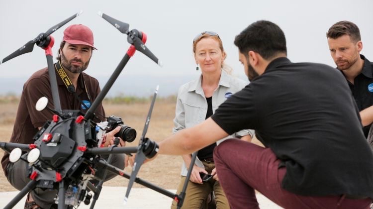 San Diego Zoo Global’s science team (L-R: Dr. James Sheppard, Dr. Megan Owen, and Dr. Nicholas Pilfold) works with the Northrop Grumman technical team in the field to refine their sensor suite to meet the needs of their Arctic conservation efforts.