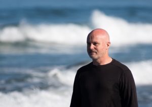 Research oceanographer Grant Deane in the surf at La Jolla Shores.