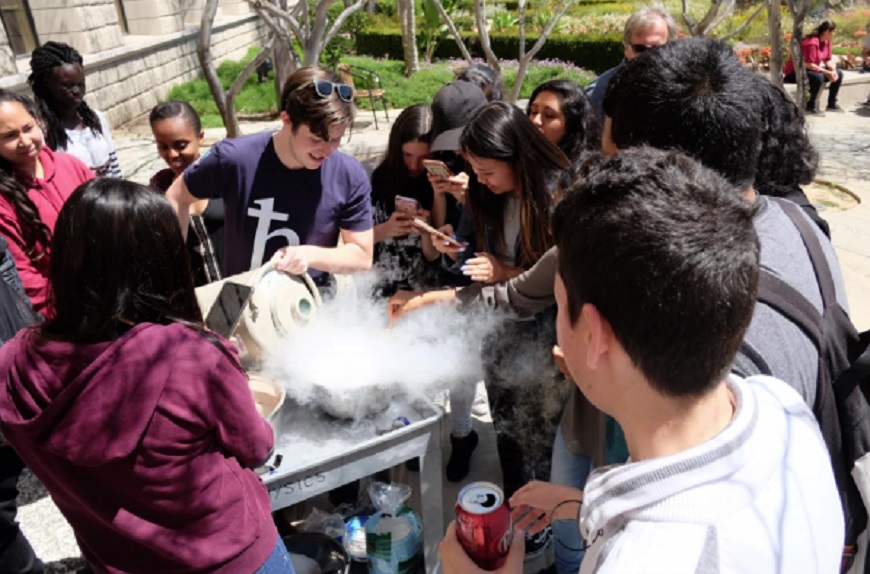 Hoover High students surround a USD student in one of the experiments. (Photo courtesy of USD)