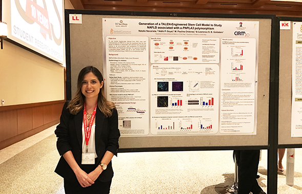 An SDSU student poses in front of her work at last year’s Student Research Symposium. (Photo courtesy of SDSU)