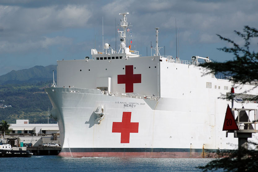 Hospital ship USNS Mercy moored in Pearl Harbor in this 2005 file photo. (Navy photo by Photographer's Mate 2nd Class Dennis Cantrell)