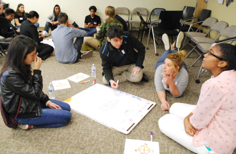 Youth Council teens, a new civic engagement organization, broke into groups with deputy public defenders to discuss the strengths of various leadership types, and to identify their own styles.