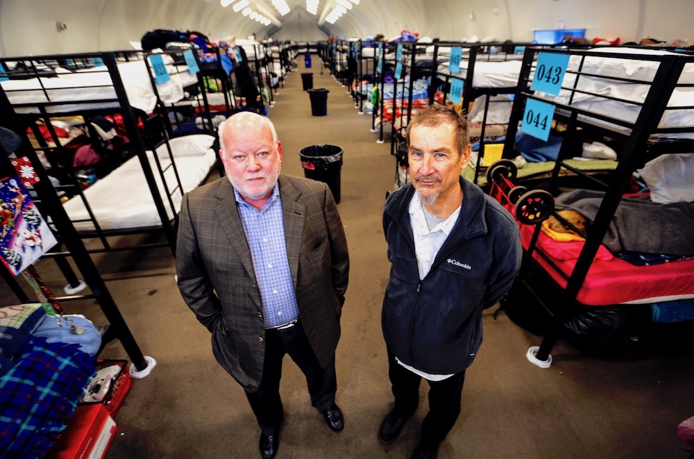 Dan Shea, left, and Peter Seidler in one of the tents erected to house some of San Diego’s homeless population. (Photo by Jamie Lytle Scott)