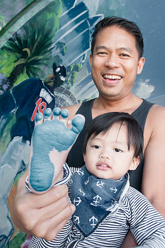 Delfin Esposo and his son contributed a footprint to the mural.