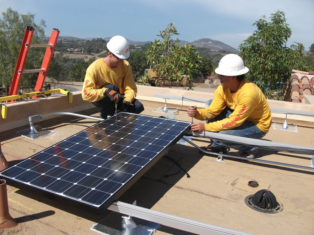 Sullivan Solar Power employees install a solar system. (Courtesy of Sullivan Solar Power)