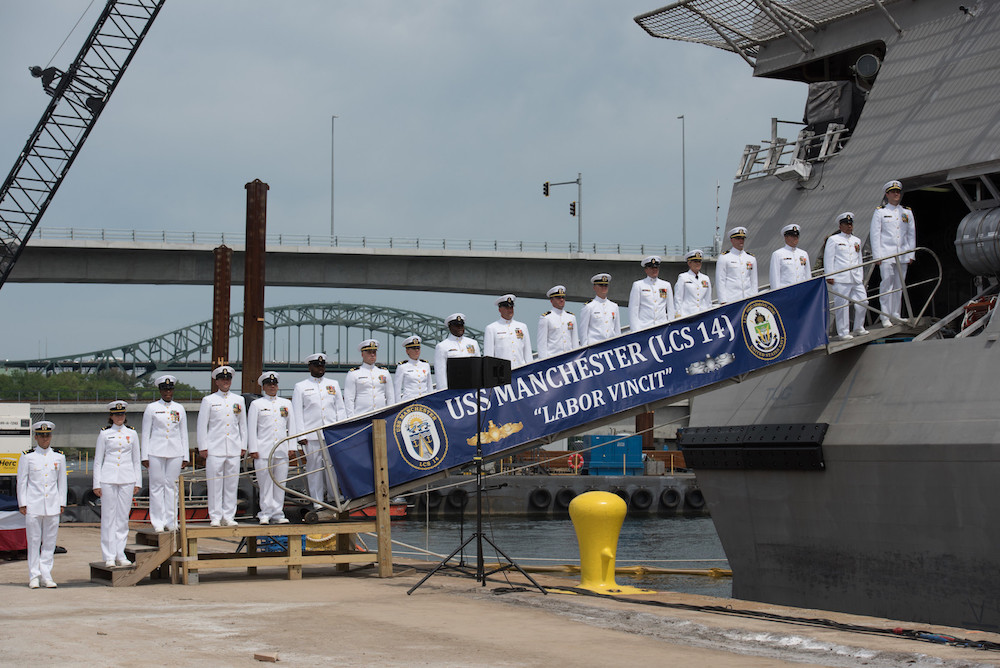 The crew of the littoral combat ship USS Manchester man the rails during the ship’s commissioning ceremony. Manchester is the 12th littoral combat ship to enter the fleet. (Navy photo by Petty Officer 2nd Class Jacob I. Allison) 