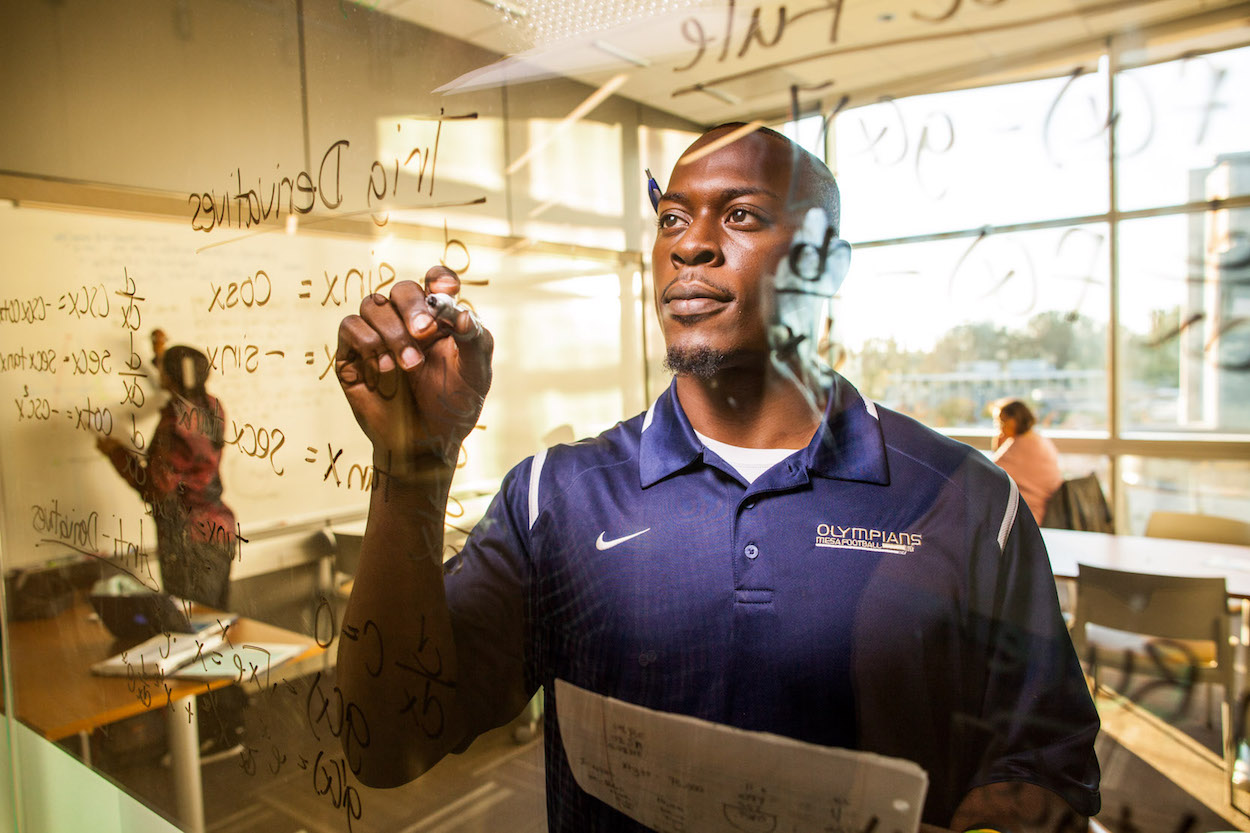 Stephen Adegoke working in a classroom at San Diego Mesa College. (Photo courtesy of San Diego Community College District)