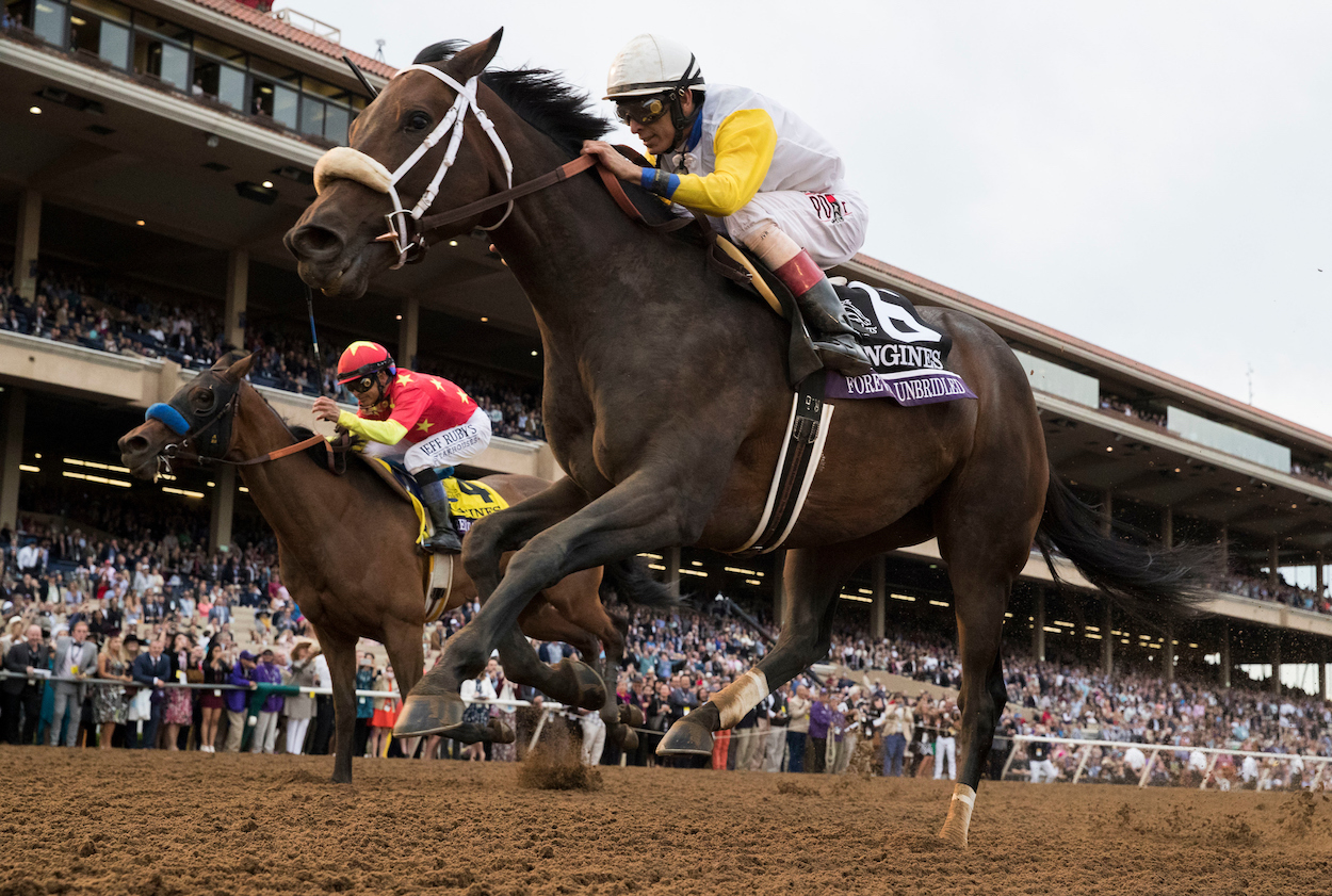 DEL MAR, CA - NOVEMBER 03: Forever Unbridled #6, ridden by John Velazquez, sprints along the home stretch while trying to hold off Abel Tasman #4, ridden by Mike Smith, on Day 1 of the 2017 Breeders' Cup World Championships at Del Mar Thoroughbred Club on November 3, 2017 in Del Mar, California. (Photo by Alex Evers/Eclipse Sportswire/Breeders Cup)