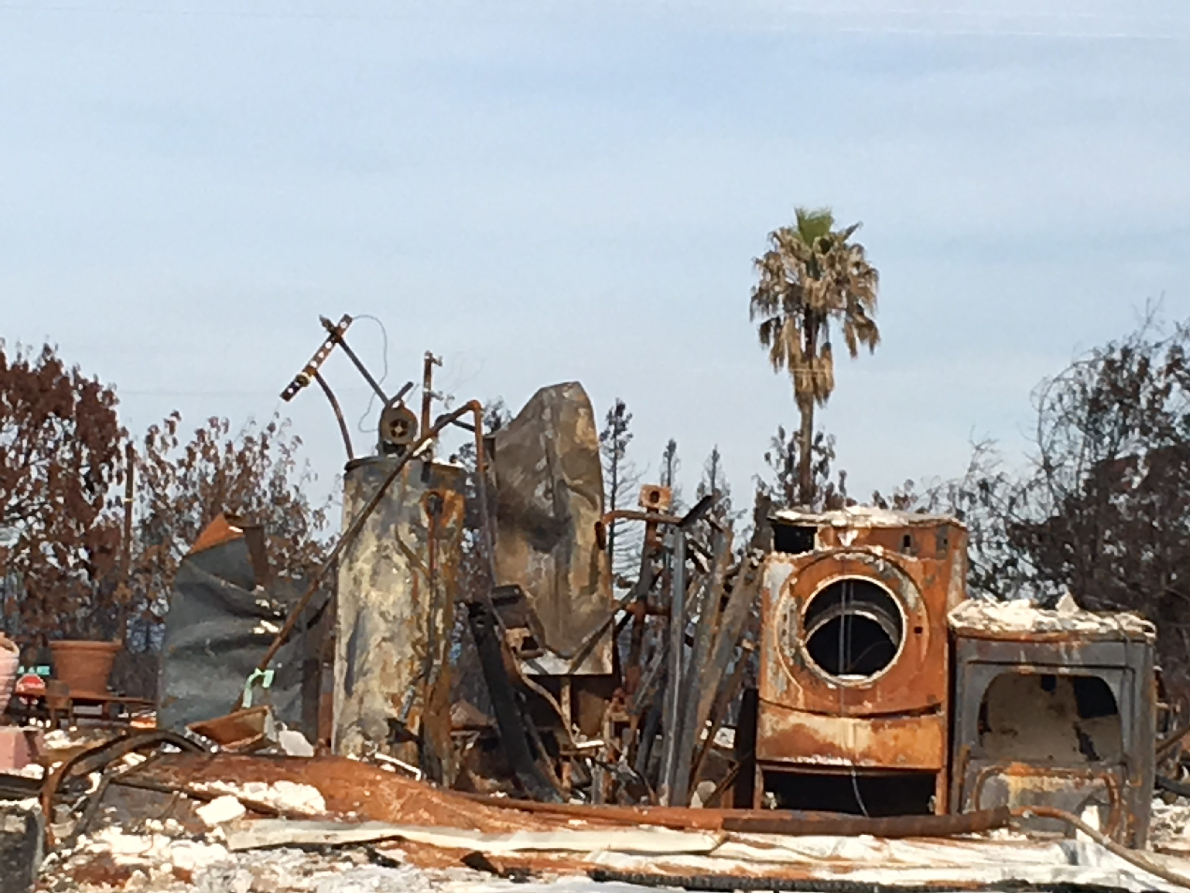 Burned appliances in Coffey Park after the 2017 wildfires in Santa Rosa — one of many blazes fueling a Capitol debate about fire insurance. (Photo by Shawn Hubler for CALmatter)