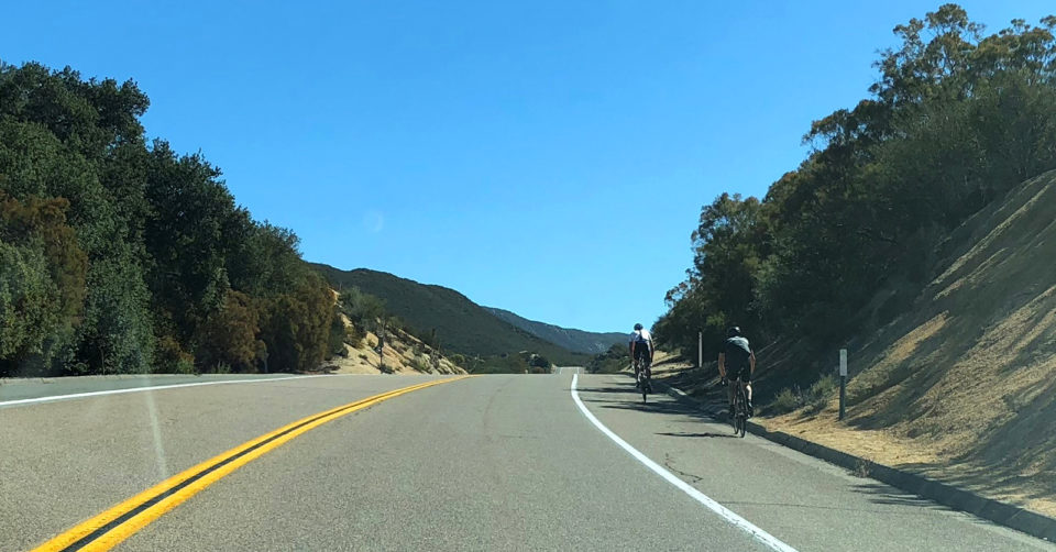 Bicyclists trekking along Old Highway 80 in bike lanes.