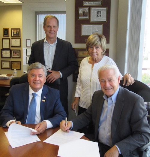 Endeavor Bank President Steve Sefton and Lead Lender Relations Specialist Maria Hughes, in rear, are pictured with SBA District Director Ruben Garcia, left, and Endeavor Bank CEO Dan Yates.