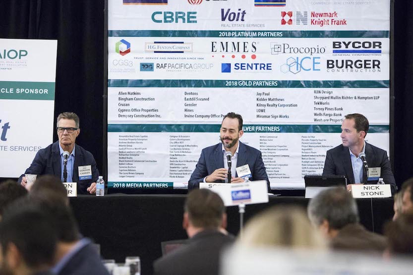 Voice of San Diego Editor in Chief Scott Lewis, center, moderates between panelists Gordon Carrier, principal architect of Carrier Johnson + Culture, left, and SoccerCity Project Manager Nick Stone, right.