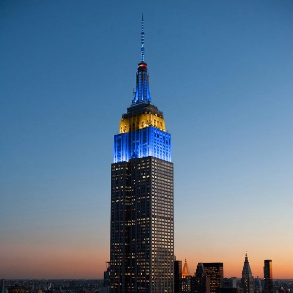The Empire State Building lights up in blue and gold —California’s state colors — in tribute to California fire victims. (CALmatters)
