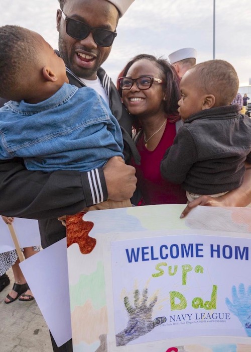 Culinary Specialist 1st Class Tyrell McCray, assigned to the future USS Tulsa, is greeted by his family during a homecoming at Naval Base San Diego. (Photo by Petty Officer 3rd Class Jason Isaacs)