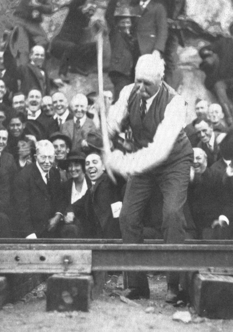 On Nov. 15, 1919, John D. Spreckels drove the final “golden spike,” which he accidentally bent, at a ceremony held at Carrizo Gorge. Photos show the crowd laughing at the bent iron railway spike, which was plated with gold. (Photo courtesy of Pacific Southwest Railway Museum Association)
