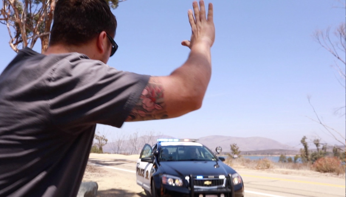 A ‘suspect’ gives himself up to Chula Vista police in this scene from a video of a simulated police call using a drone.