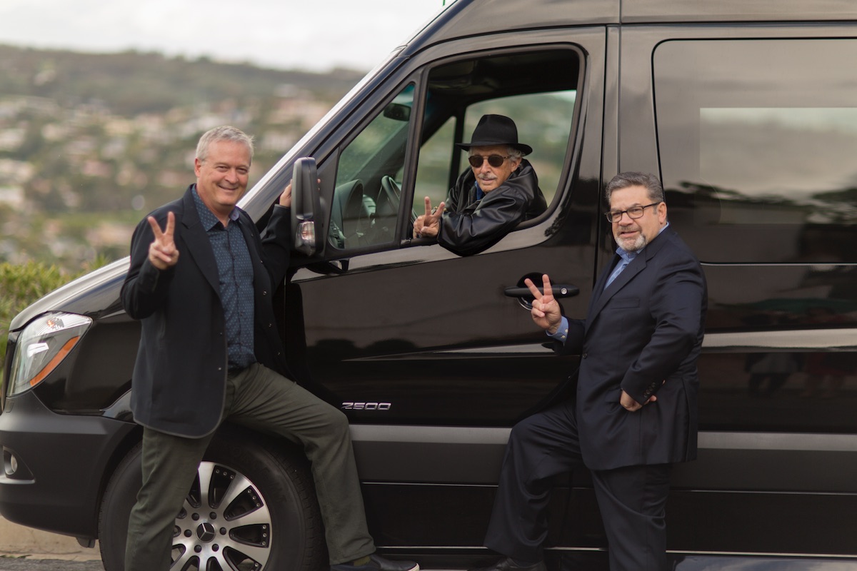 From left, the “VCs in a Van” crew – Mark Bowles, Neil Senturia (in van) and Tom Tullie – poses for a photo.(Photo courtesy of “VCs in a Van”)