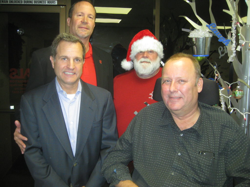 Pictured, from left: Steve Becvar, ALS; Paul Negulescu, Vertex; Keith Miller (wearing Santa hat), ALS; Peter Grootenhuis, Vertex.